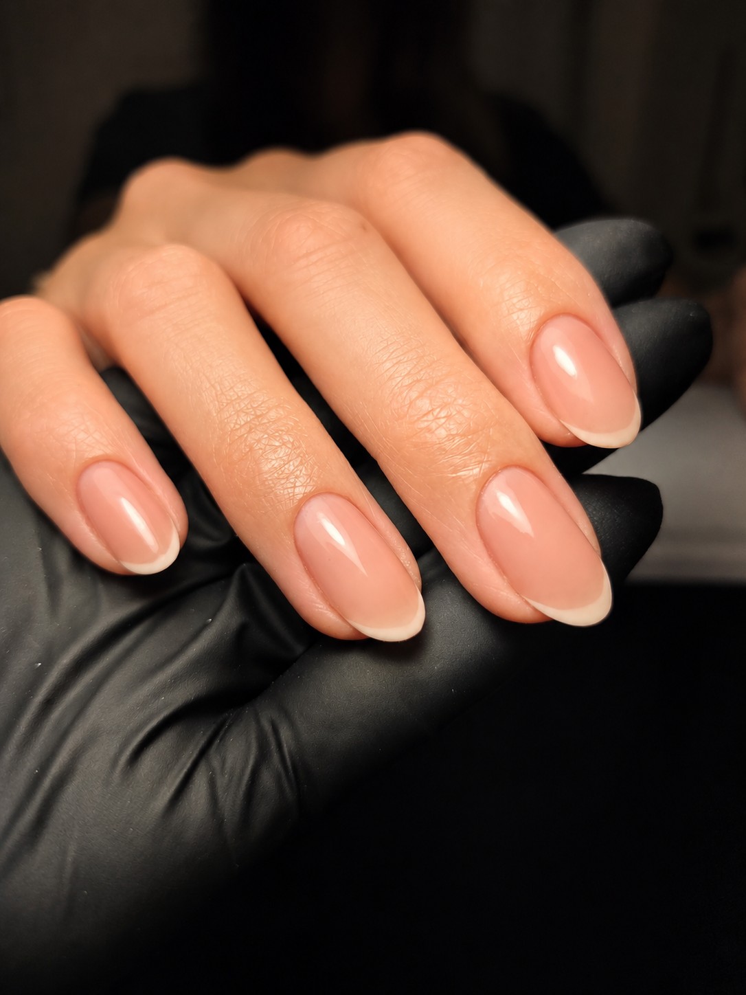 Nude almond manicure with precise cuticle work at Bella Brazil
