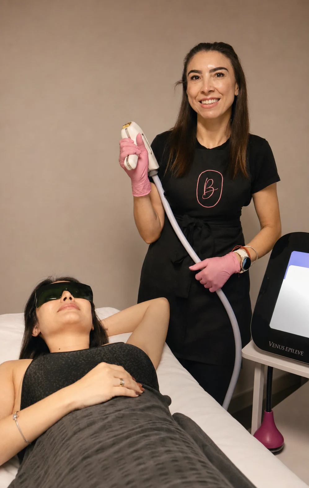Marcia at Bella Brazil holding the laser hair removal applicator