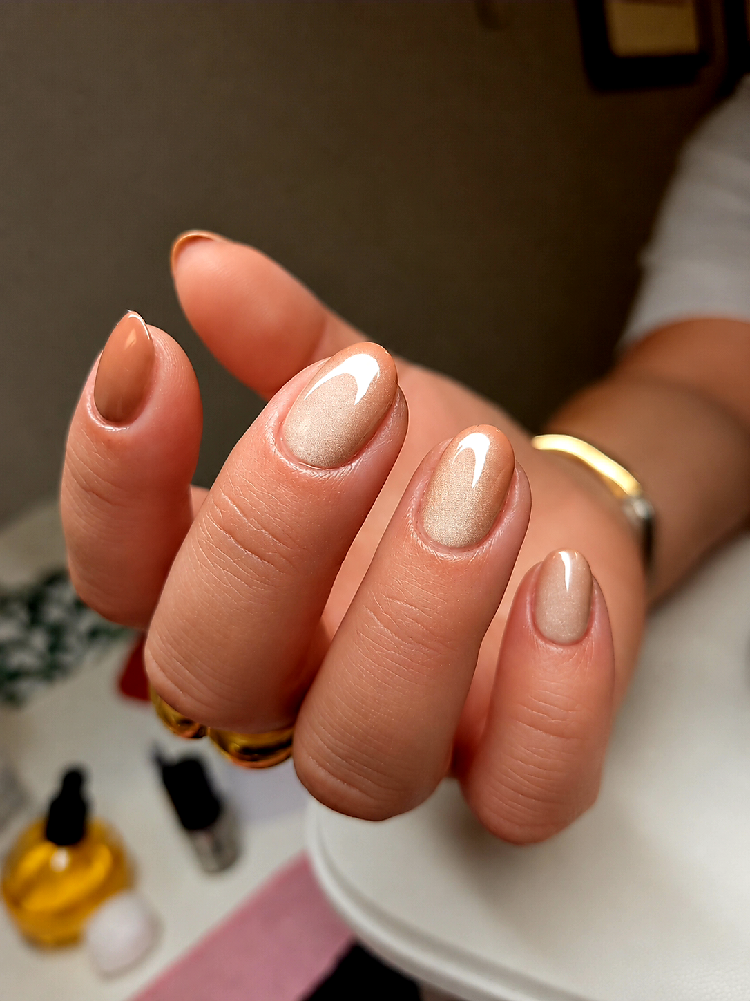 Champagne shimmer manicure finished close to the cuticle line by Bella Brazil