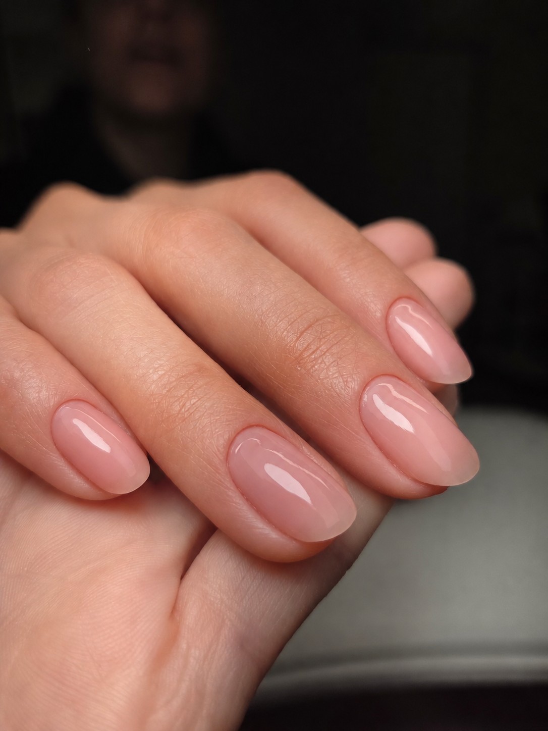 Pink nude manicure with close, controlled polish placement by Bella Brazil